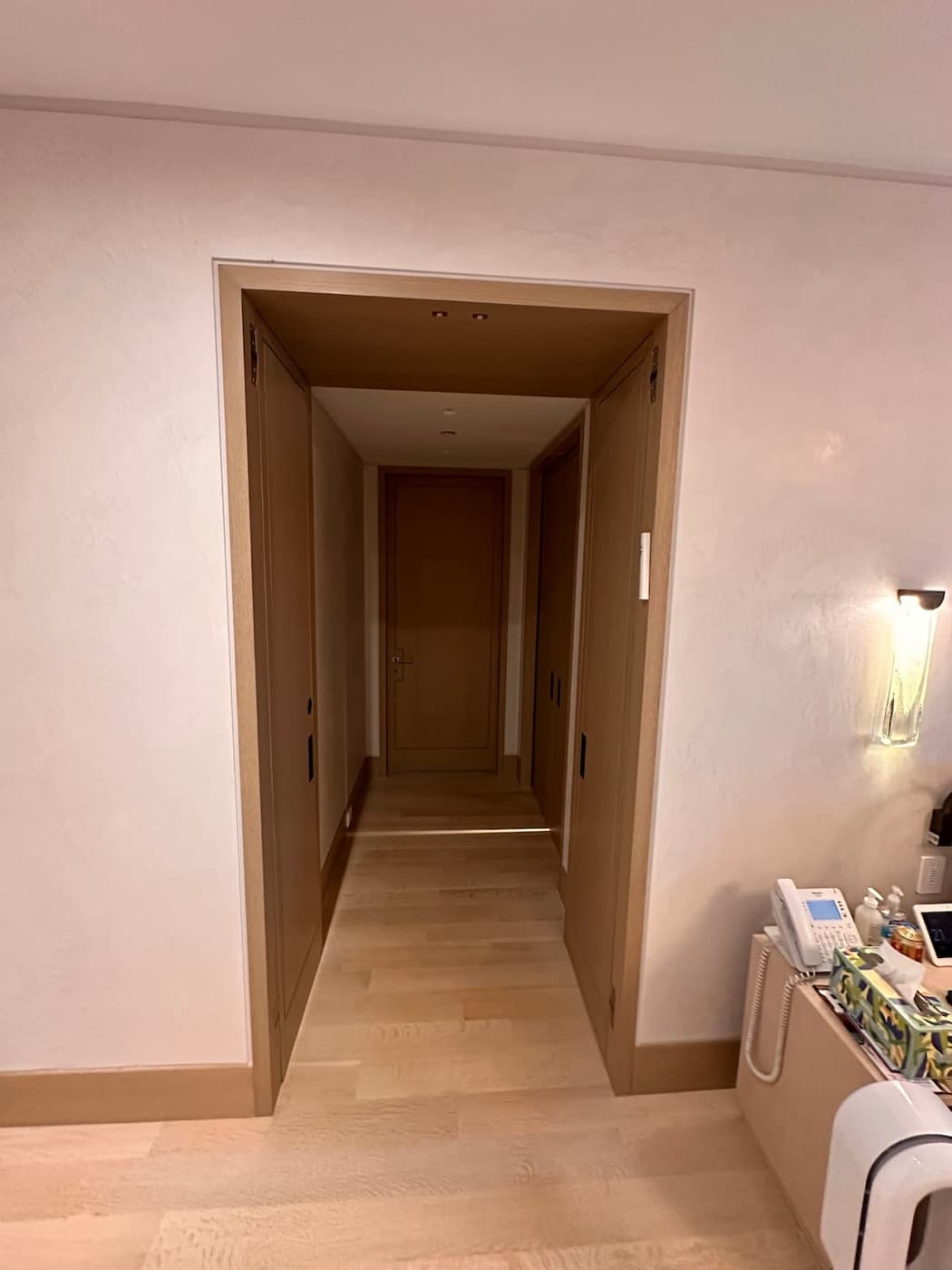 Hallway entry featuring a deep timber cased opening with built-in pocket doors and timber flooring