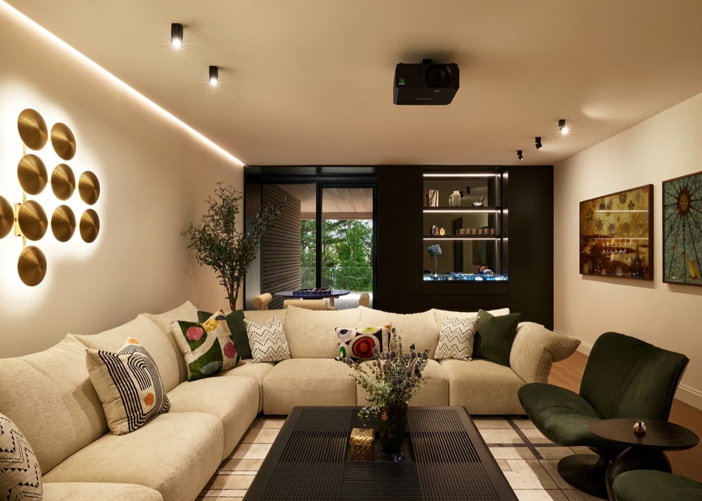 Living room featuring dark built-in bar cabinetry with illuminated display shelves and cove lighting